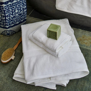 Luxurious high-quality cotton towels in a guest bathroom, offering comfort and a welcoming experience