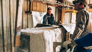 Cotton Bales And The Workers That Are Involved